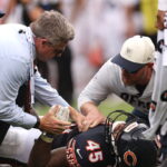 Bears LB Nephi Sewell carted off with leg injury